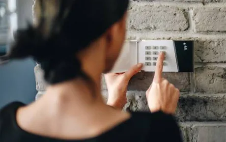 A digital keypad lock fitted to a wooden front door